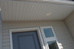 close up of window next to front entrance of home