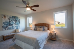 Bedroom with windows on each side of bed