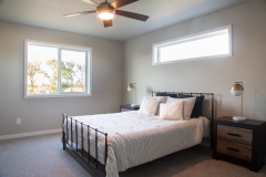 bedroom with window above bed