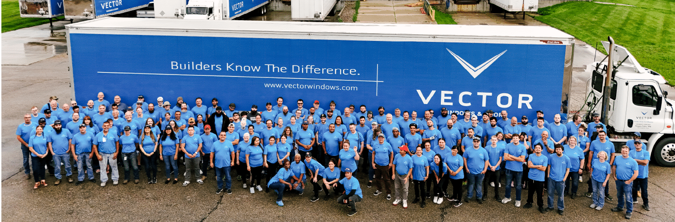 Group photo of Vector Windows staff in front of truck